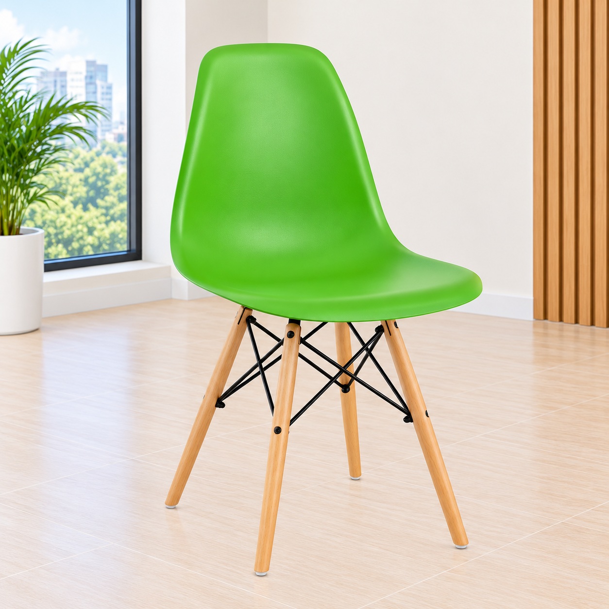 Green Eames plastic dining chair with wooden legs